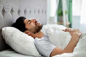Male Sleeping In Bed