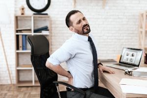 An office worker with lower back pain.