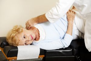 A person getting chiropractic adjustment for their posture.